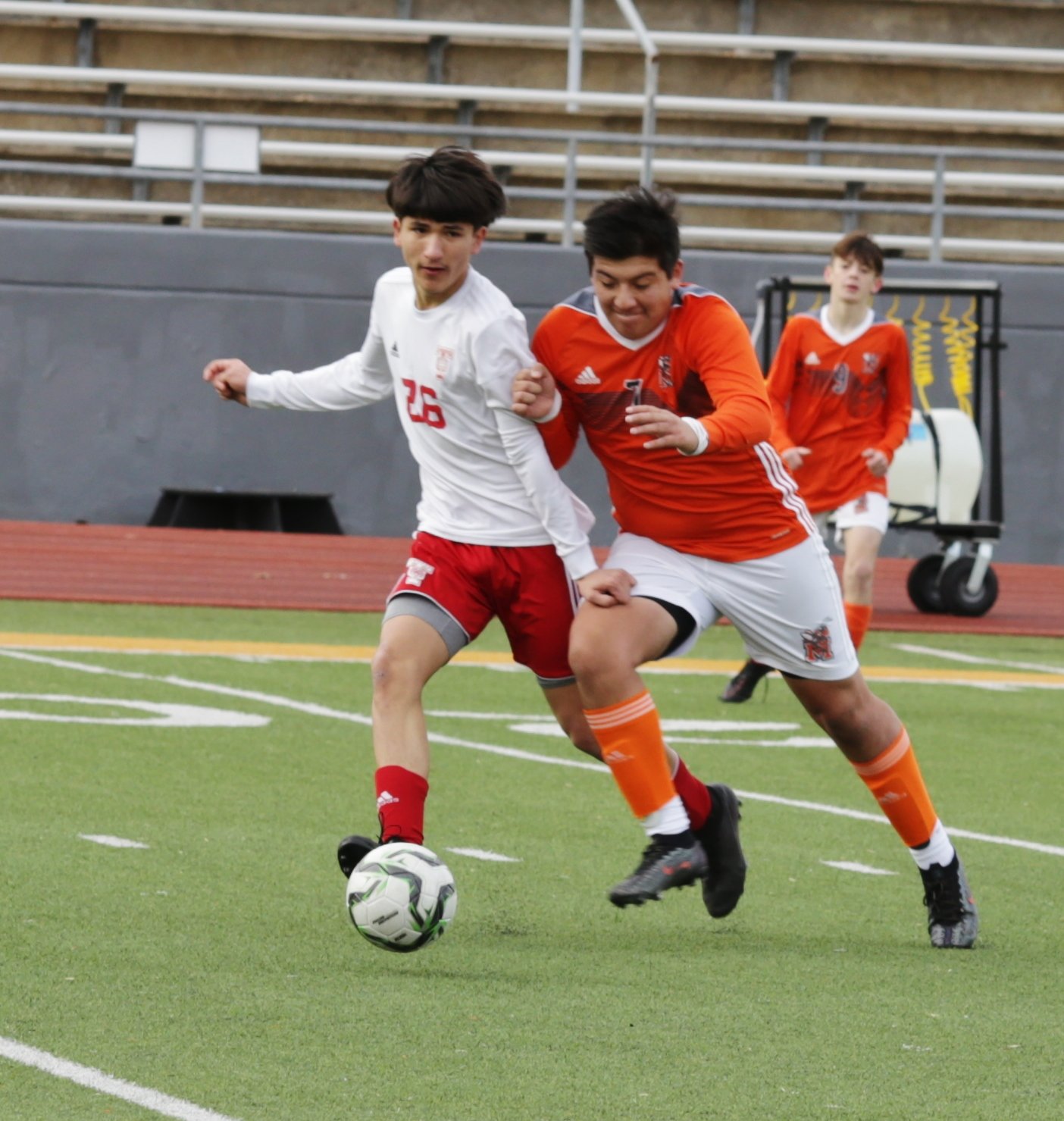 Mineola’s Christian Martinez competes for a ball in the midfield.